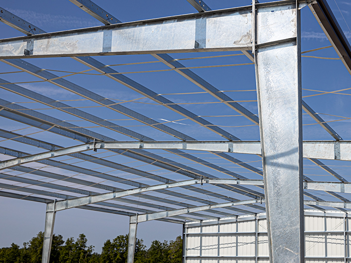Covered steel riding arena erected on a prepared site